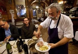 People at a table in a Lyon restaurant