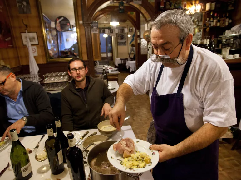 People at a table in a Lyon restaurant