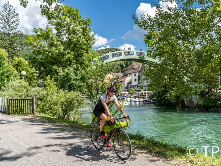 Cyclist  along the Canal de Savière 