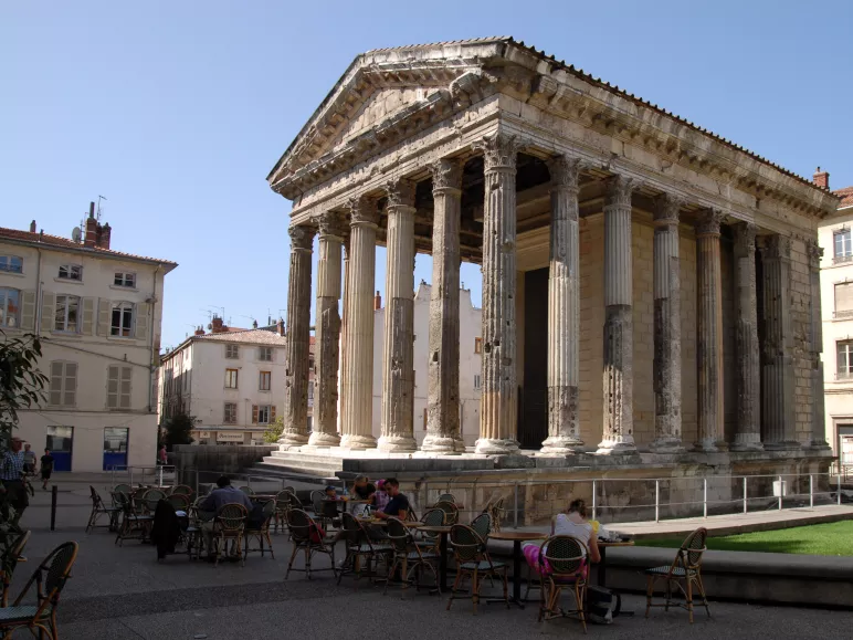 Terrace cyclists in front of the Roman temple of Augustus and Livia in Vienna